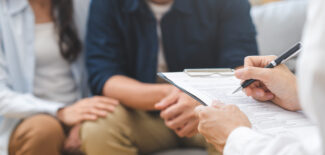 Couple consulting with a doctor