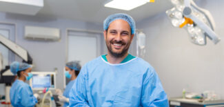 Portrait of male surgeon or staff member dressed in surgical scrubs