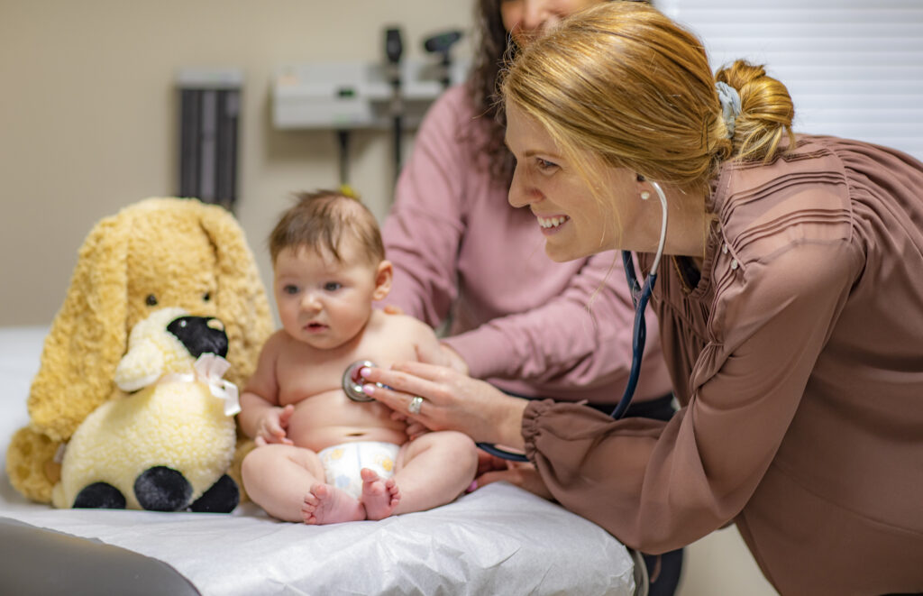 Provider examining an infant